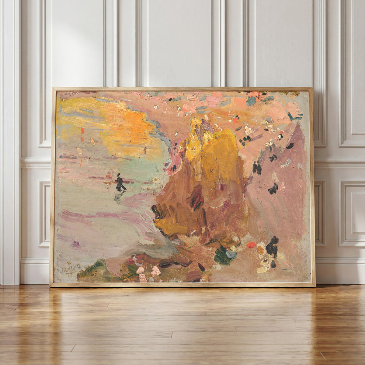 Framed art print of Beach of Biarritz by Joaquín Sorolla, in a light wood frame leaning against a panelled white wall