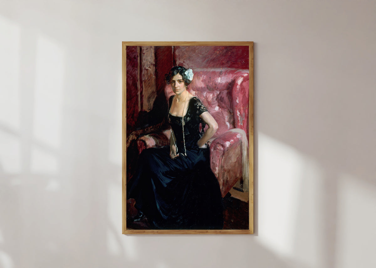 Framed art print of Clotilde in Evening Dress by Joaquín Sorolla, in a light wood frame on a sunlit white wall