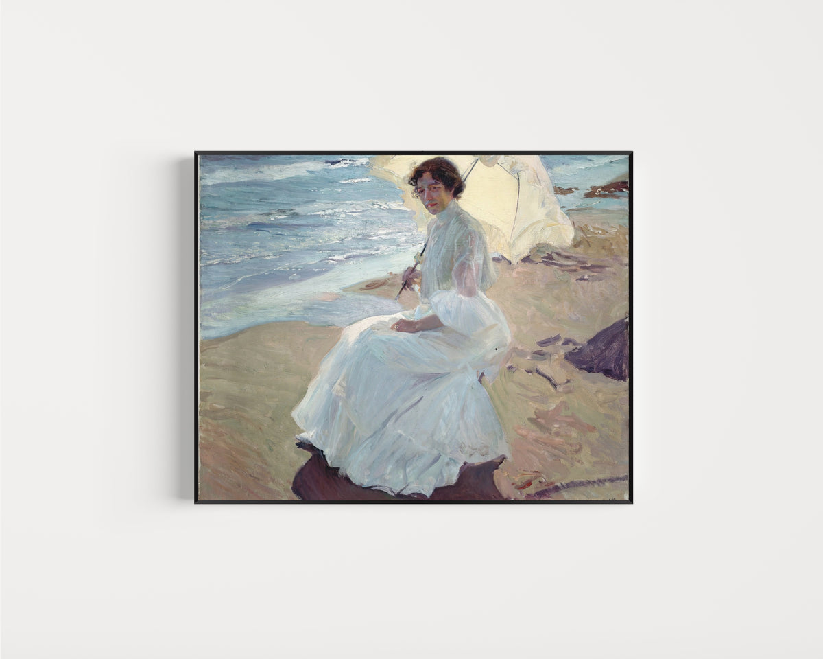 Framed art print of Clotilde on the Beach by Joaquín Sorolla, in a slim black frame on a plain white wall