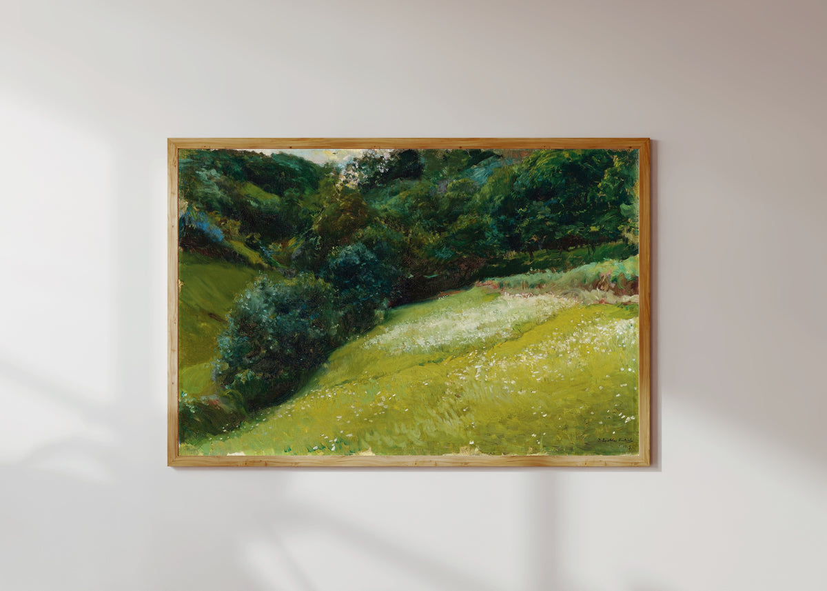 Framed art print of Field in Asturias, San Esteban de Pravia by Joaquín Sorolla, in a light wood frame on a sunlit white wall