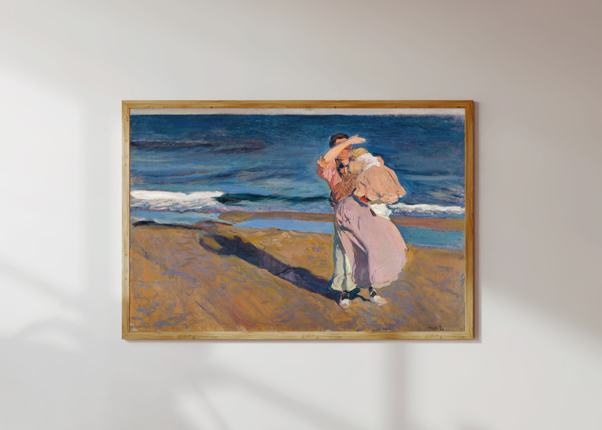 Framed art print of Fisherwoman with her Son by Joaquín Sorolla, in a light wood frame on a sunlit white wall