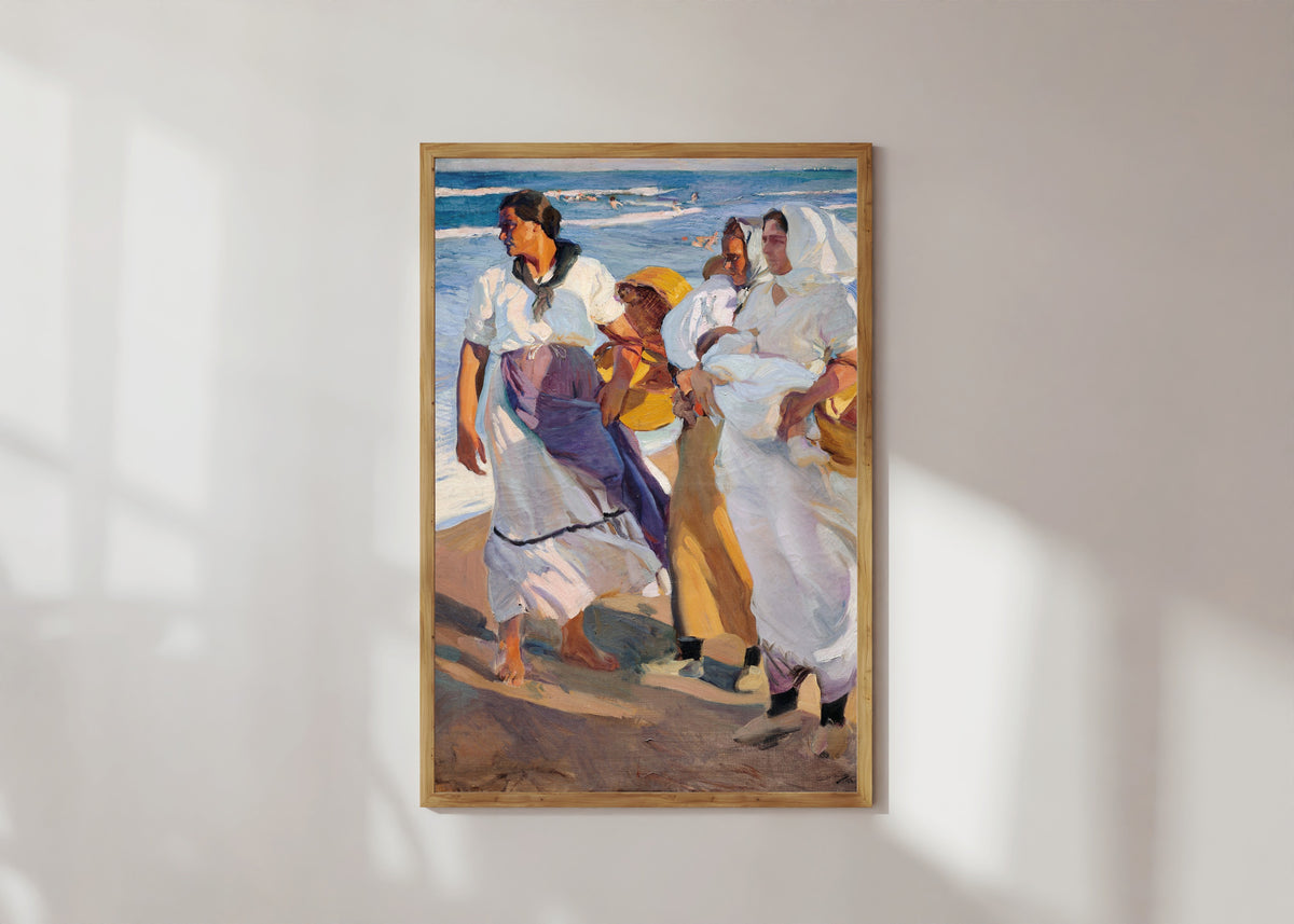 Framed art print of Fisherwomen from Valencia by Joaquín Sorolla, in a light wood frame on a sunlit white wall