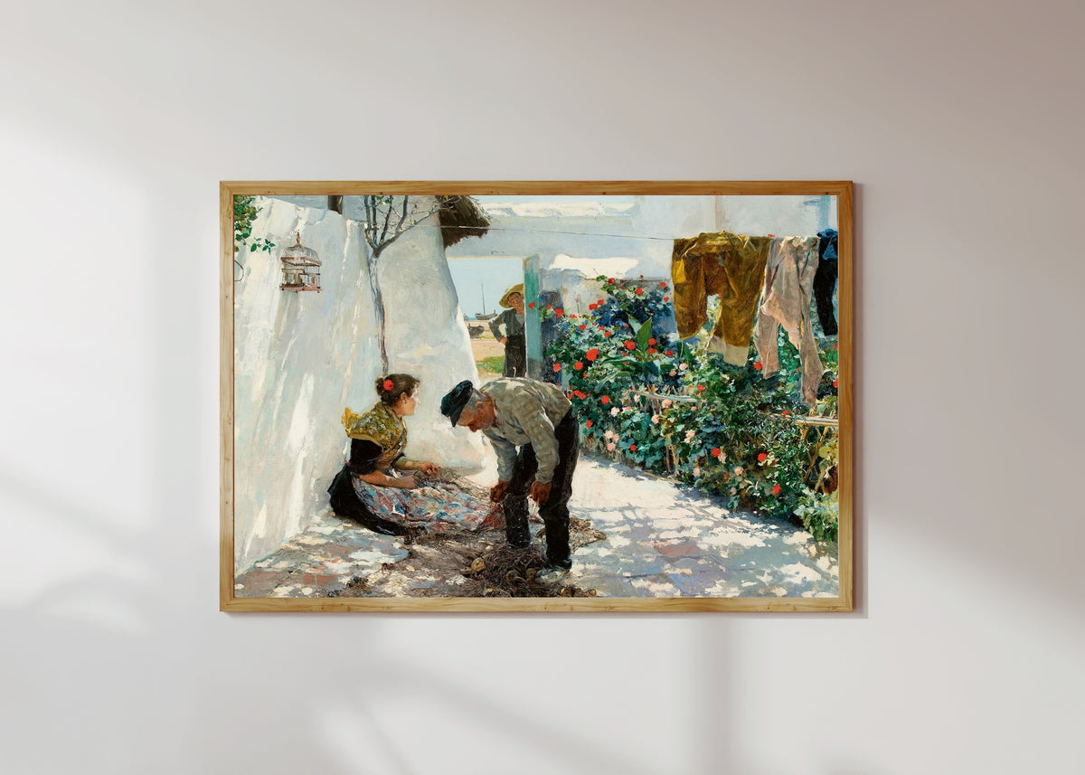 Framed art print of Fishing Nets (Las redes) by Joaquín Sorolla, in a light wood frame on a sunlit white wall
