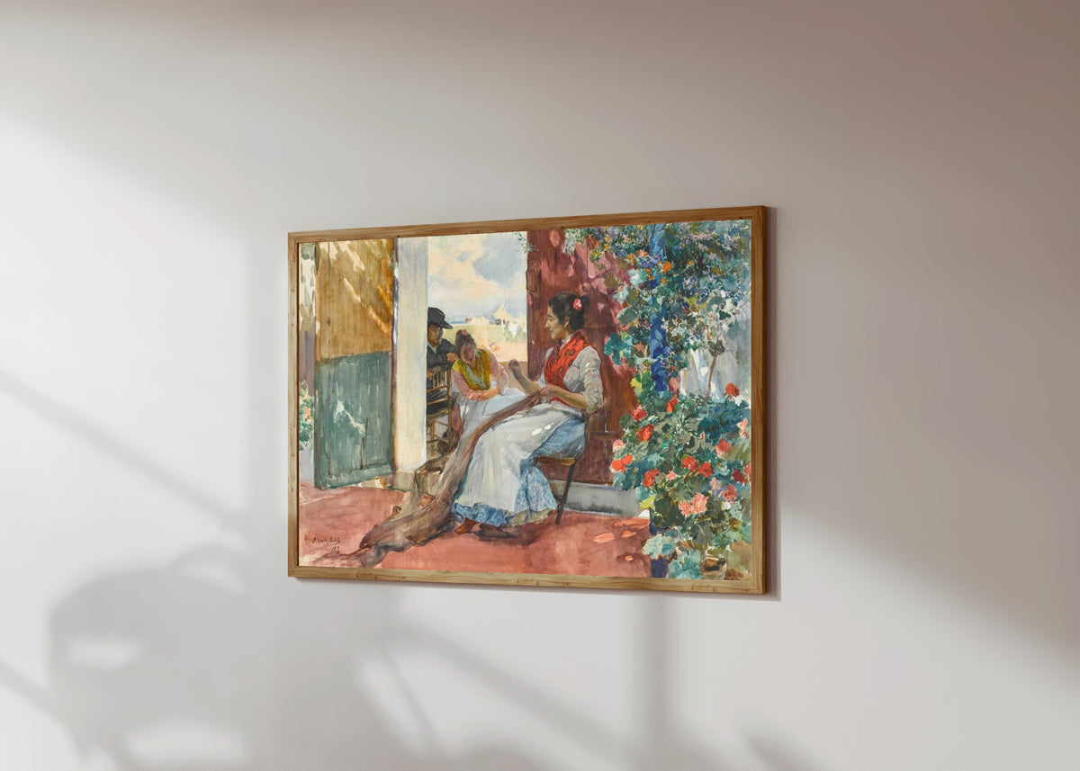 Framed art print of Mending the Nets by Joaquín Sorolla, in a light wood frame on a sunlit white wall, seen at a slight angle