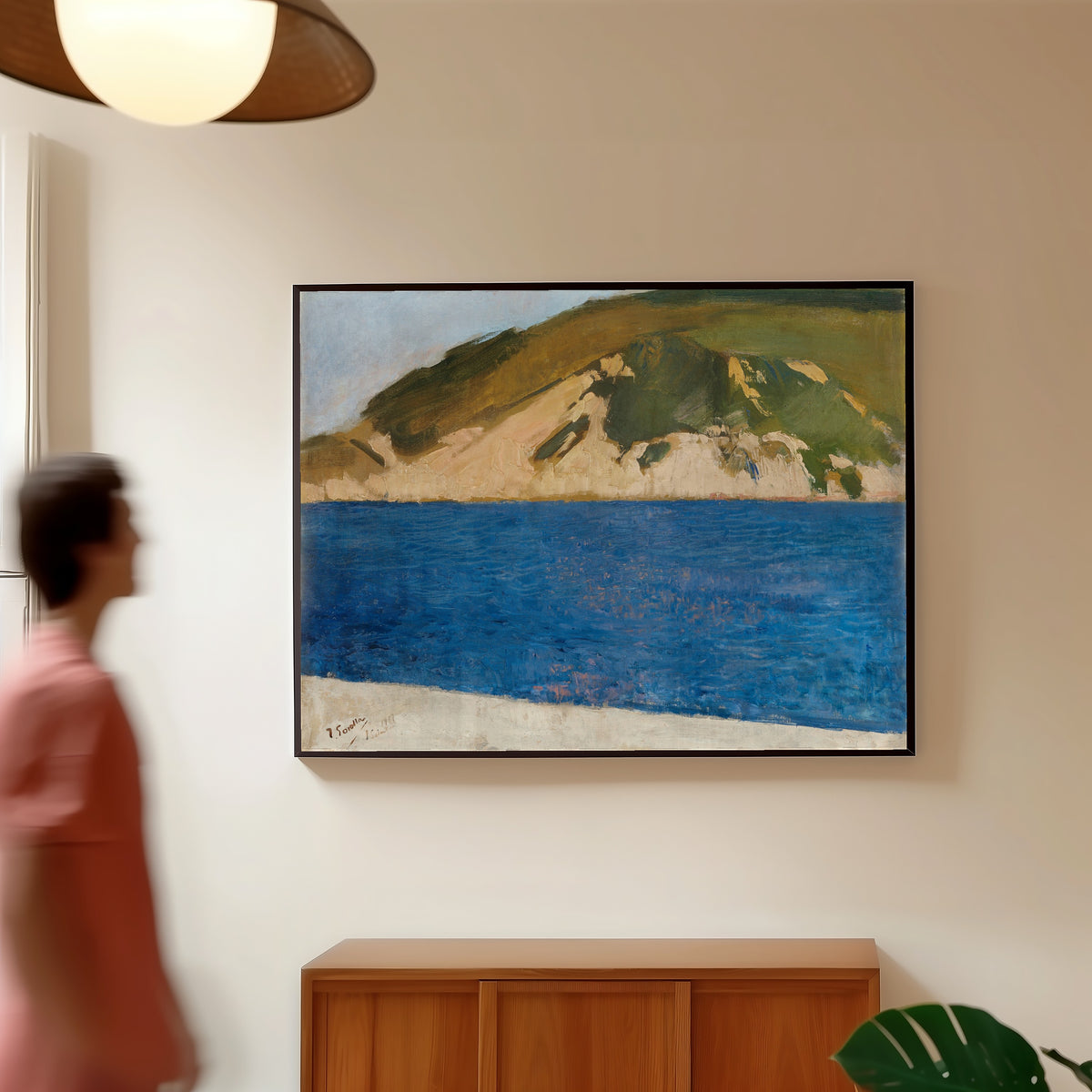 Framed art print of Monte Ulía, San Sebastián by Joaquín Sorolla, in a slim black frame on a warm wall in a sunlit room