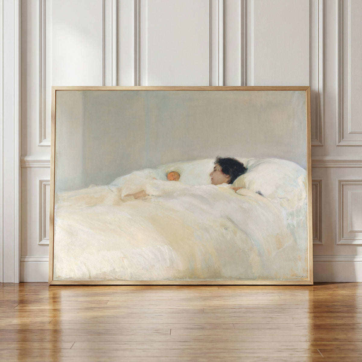 Framed art print of Mother by Joaquín Sorolla, in a light wood frame leaning against a panelled white wall