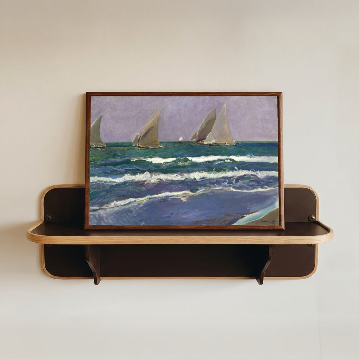 Framed art print of Sails at Sea, Valencia (Velas en el mar) by Joaquín Sorolla, in a dark wood frame resting on a wall shelf