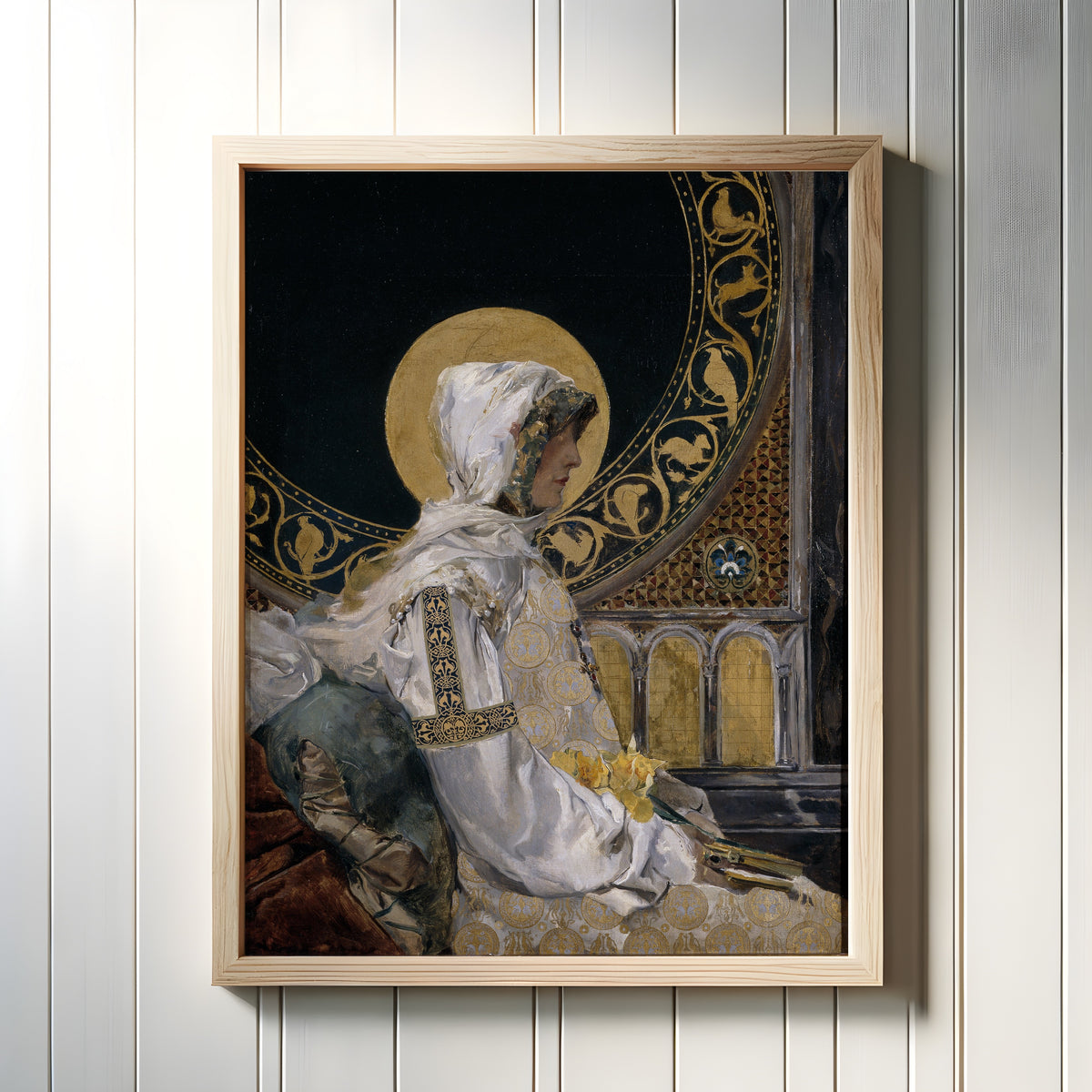 Framed art print of Saint in Prayer (Santa en oración) by Joaquín Sorolla, in a light wood frame on a white panelled wall