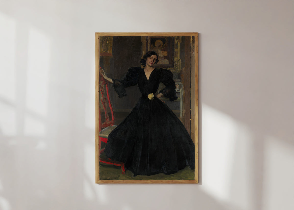 Framed art print of Señora de Sorolla in Black by Joaquín Sorolla, in a light wood frame on a sunlit white wall