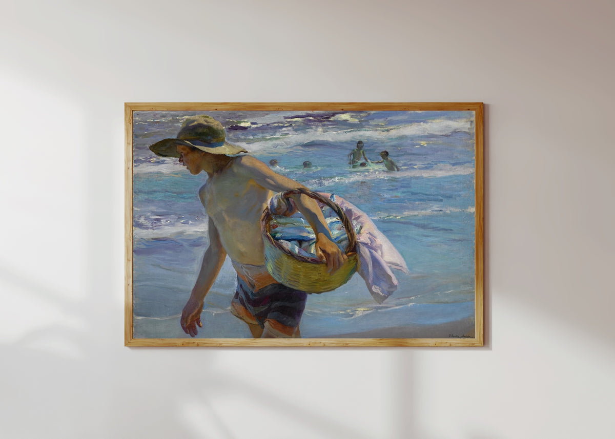 Framed art print of The Fisherman (El Pescador) by Joaquín Sorolla, in a light wood frame on a sunlit white wall
