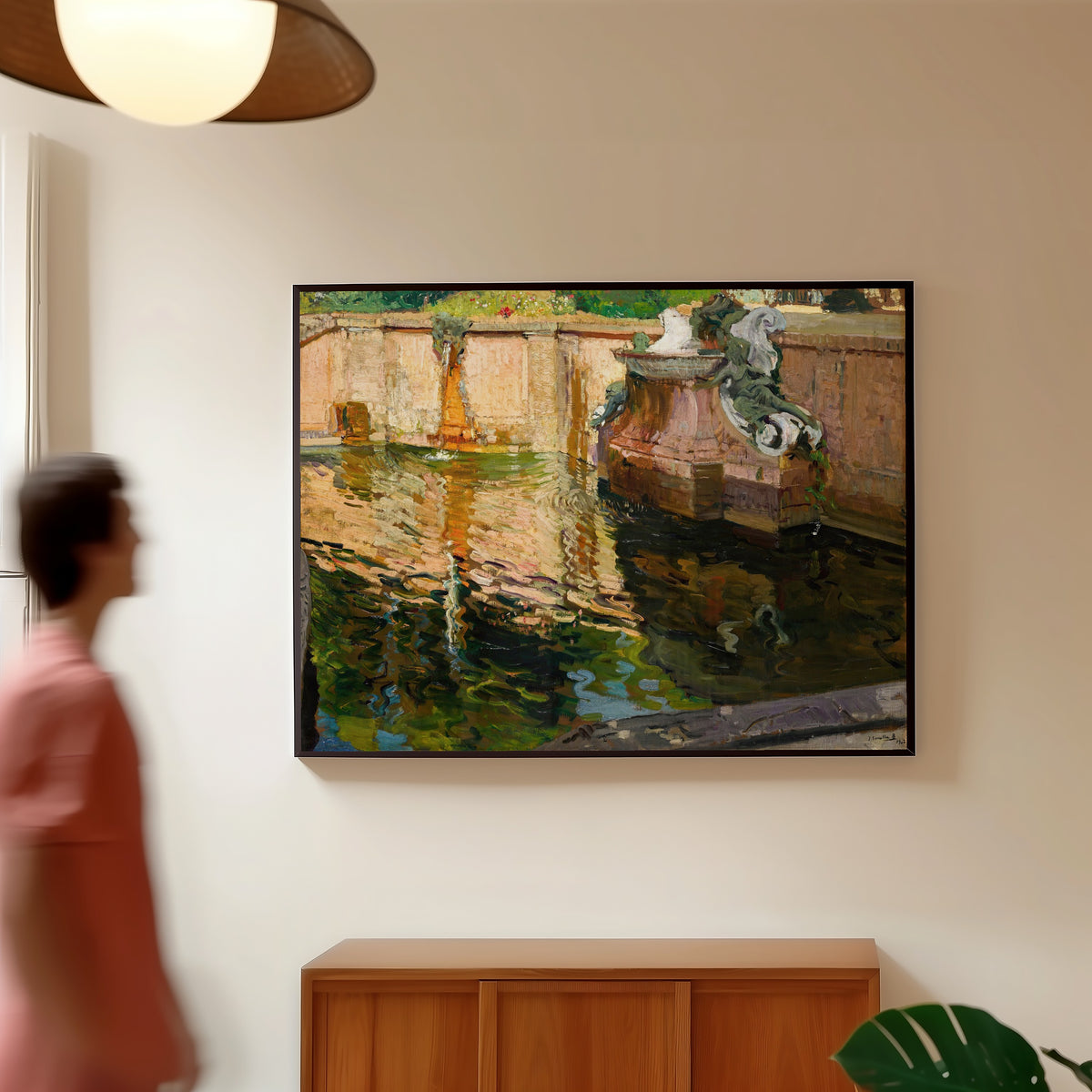Framed art print of The Horses Fountain, La Granja by Joaquín Sorolla, in a slim black frame on a warm wall in a sunlit room