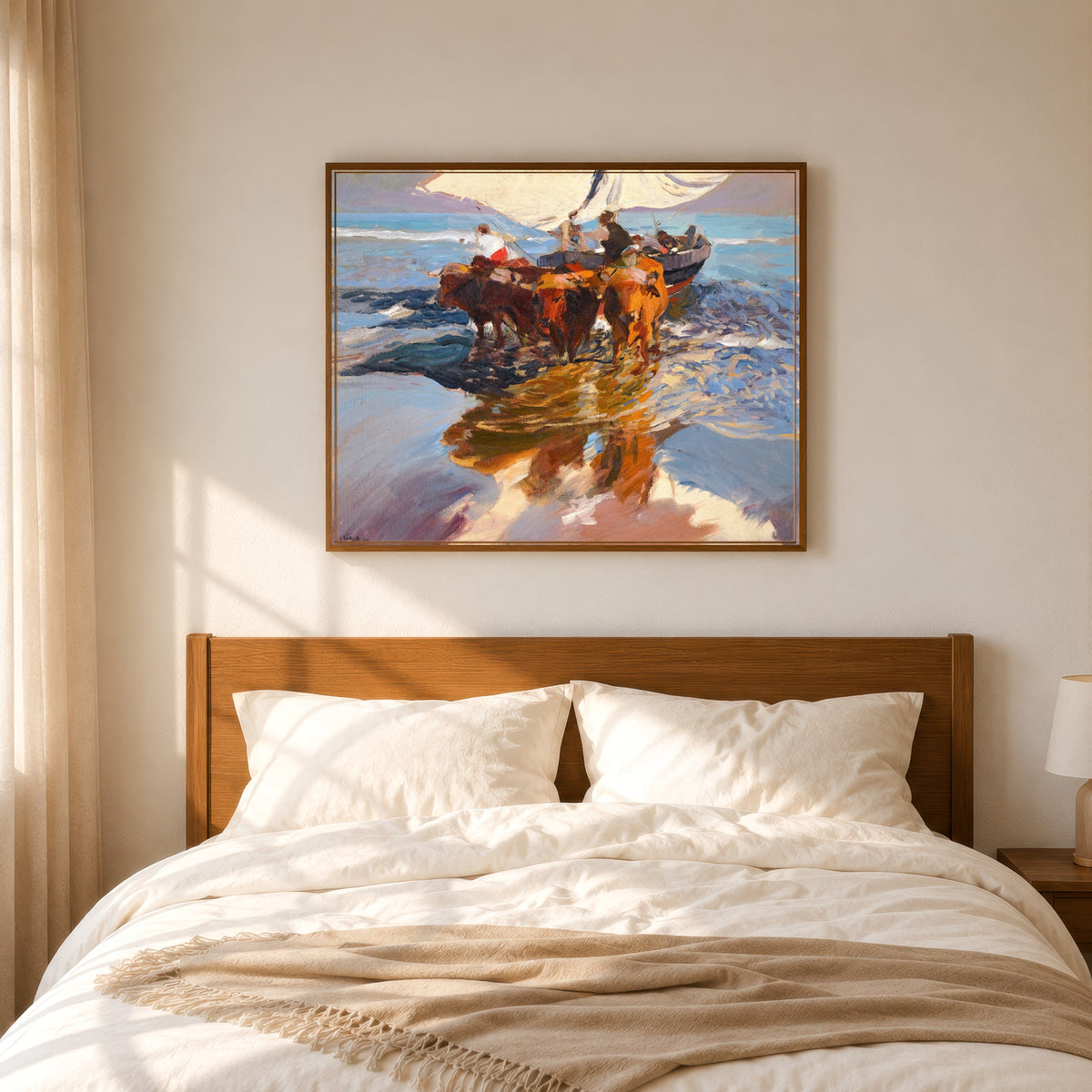 Framed art print of The Return from Fishing, Valencia Beach by Joaquín Sorolla, in a slim wood frame above a bed in a sunlit bedroom