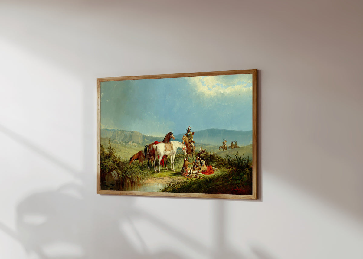 Framed art print of Indians Playing Cards by John Mix Stanley, in a light wood frame on a sunlit white wall, seen at a slight angle
