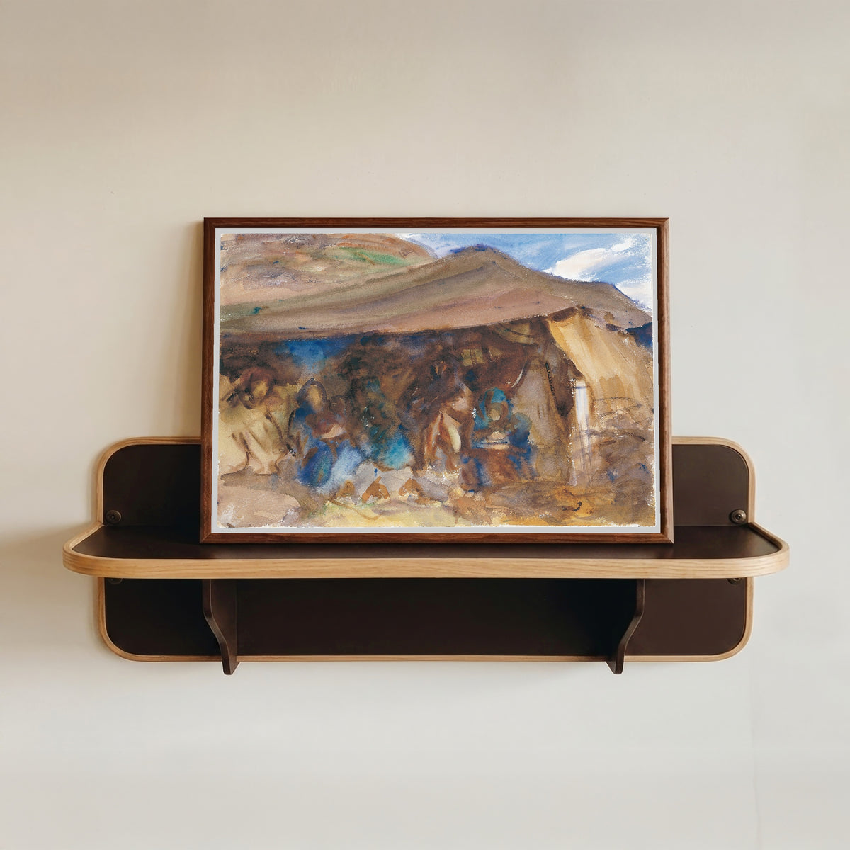 Framed art print of Bedouin Tent by John Singer Sargent, in a dark wood frame resting on a wall shelf