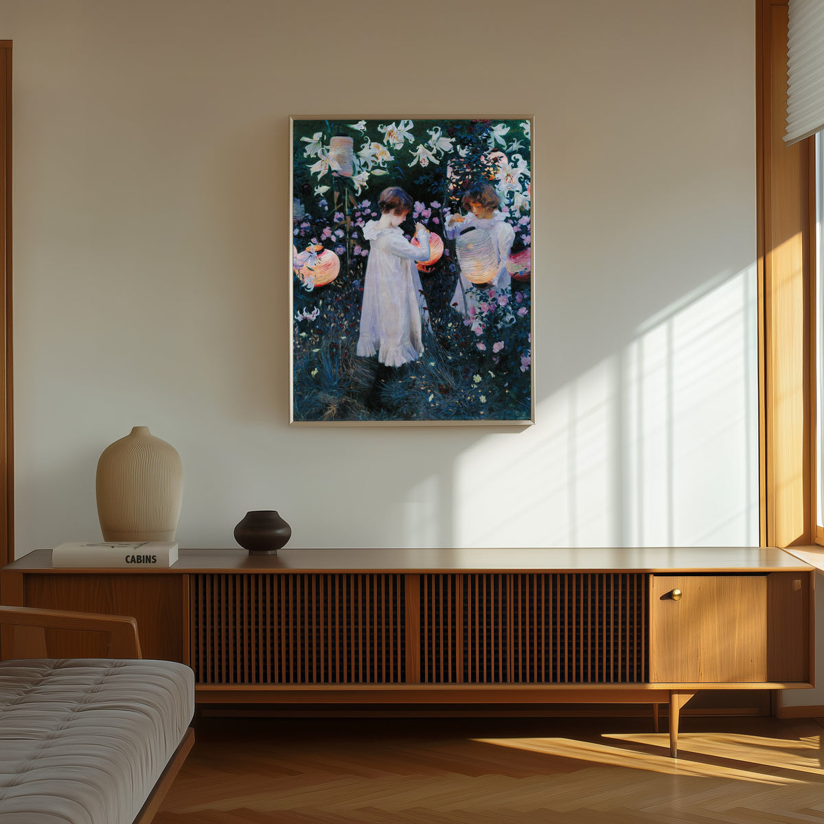 Framed art print of Carnation, Lily, Lily, Rose by John Singer Sargent, in a thin light frame on a sunlit wall above a wooden sideboard