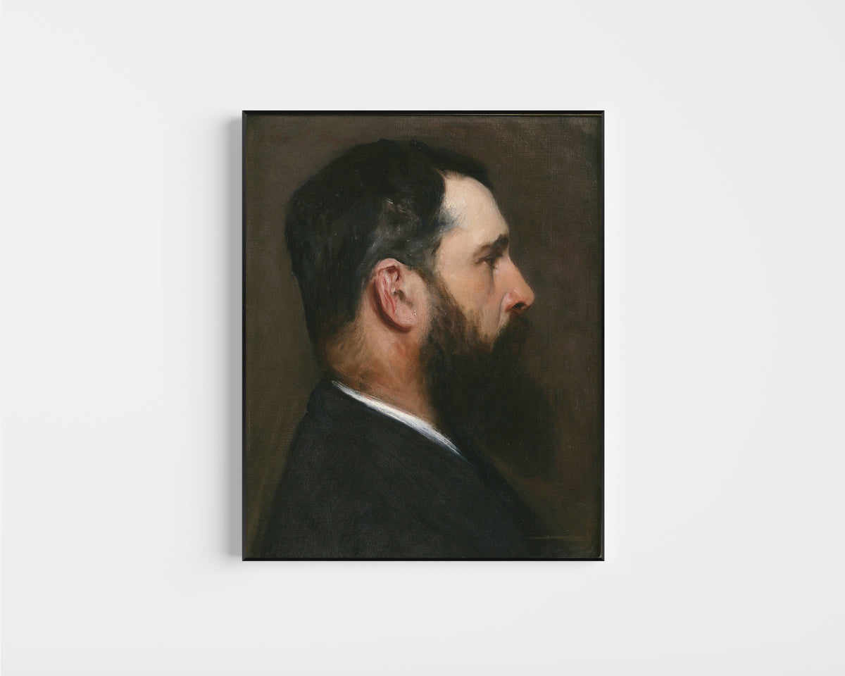 Framed art print of Claude Monet by John Singer Sargent, in a slim black frame on a plain white wall