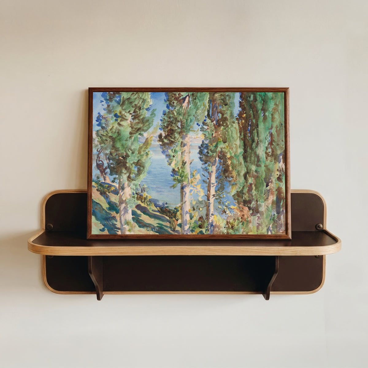 Framed art print of Corfu: Cypresses by John Singer Sargent, in a dark wood frame resting on a wall shelf