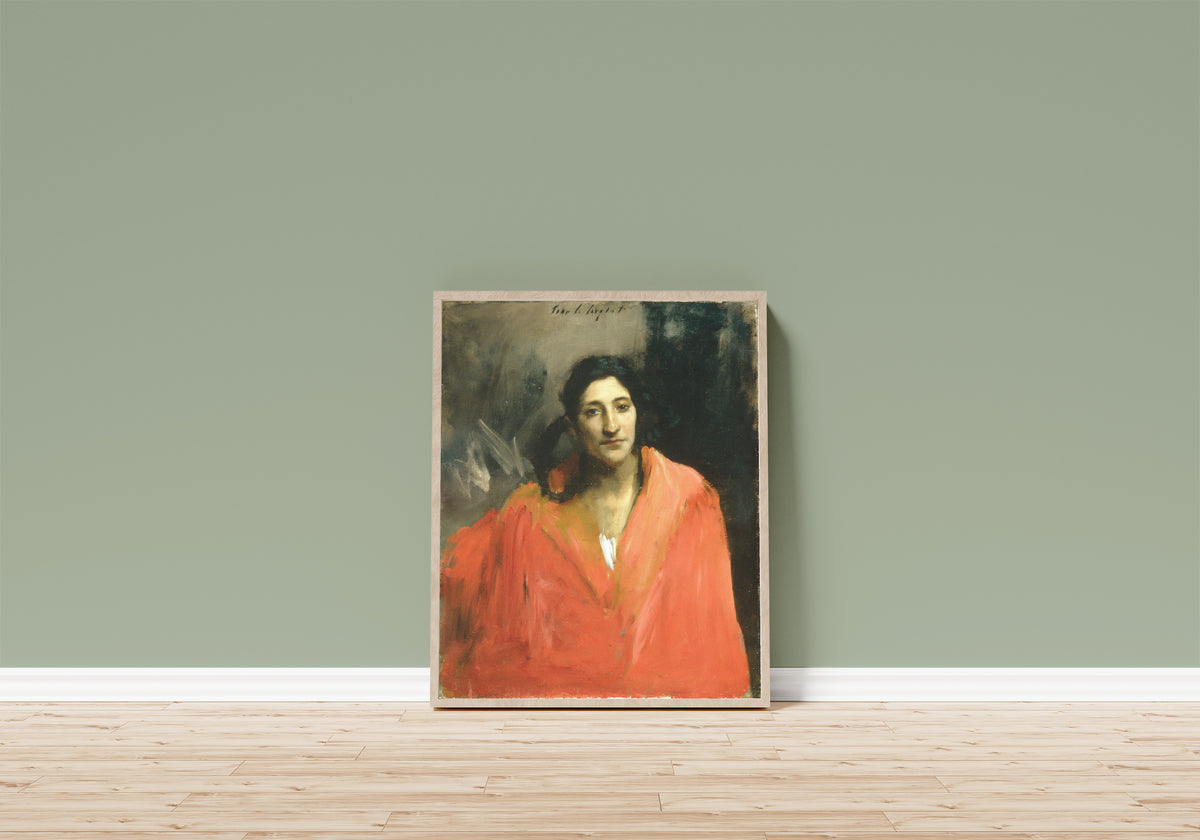 Framed art print of Gitana by John Singer Sargent, in a light wood frame leaning on a sage green wall above a wooden floor