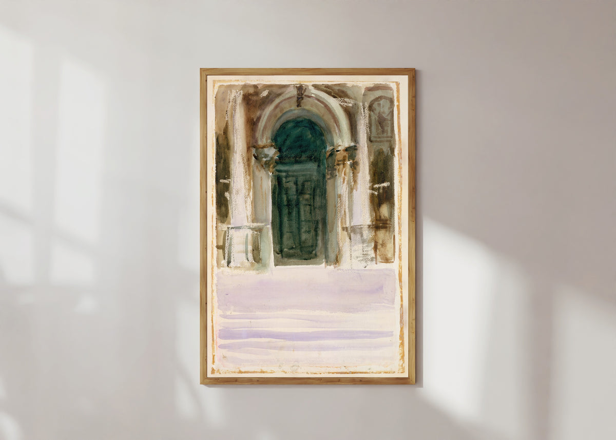 Framed art print of Green Door, Santa Maria della Salute by John Singer Sargent, in a light wood frame on a sunlit white wall