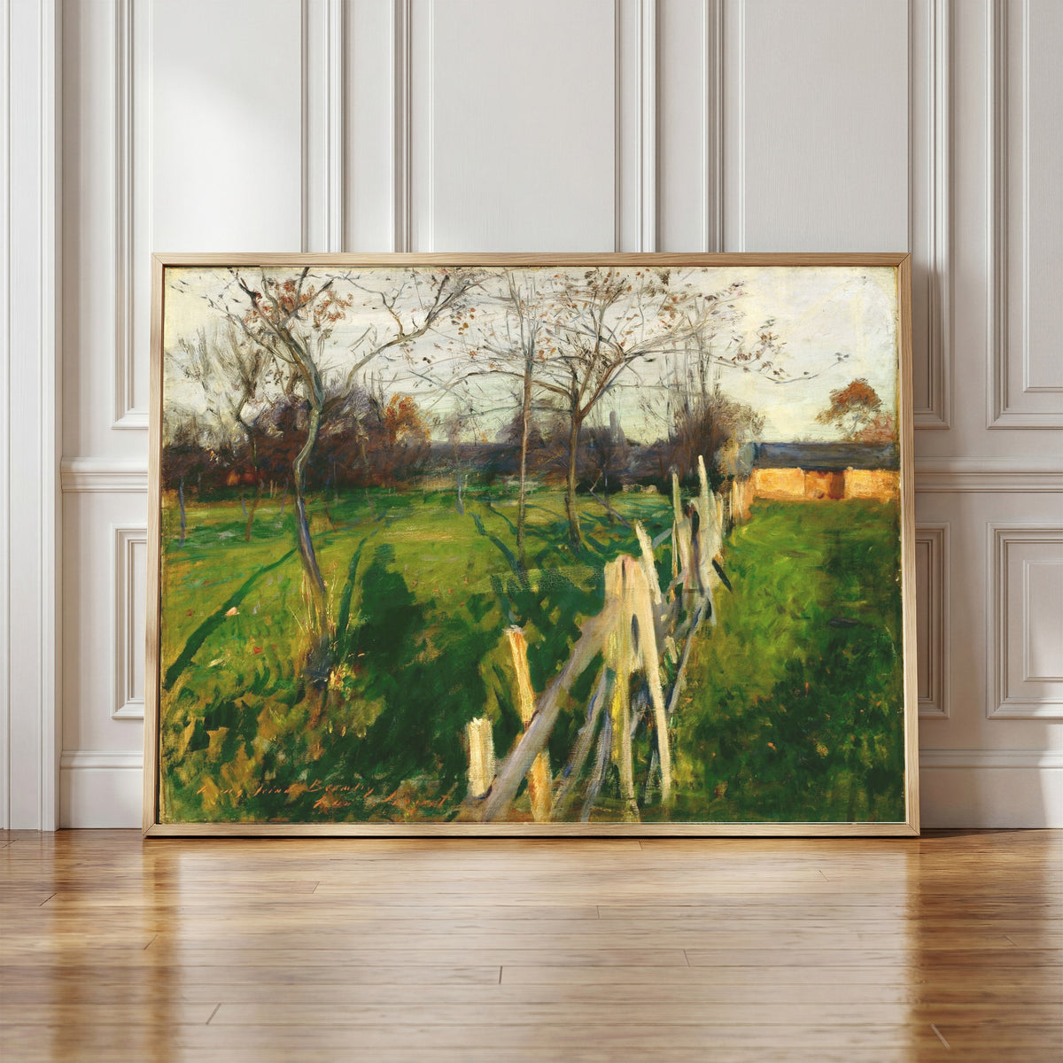 Framed art print of Home Fields by John Singer Sargent, in a light wood frame leaning against a panelled white wall