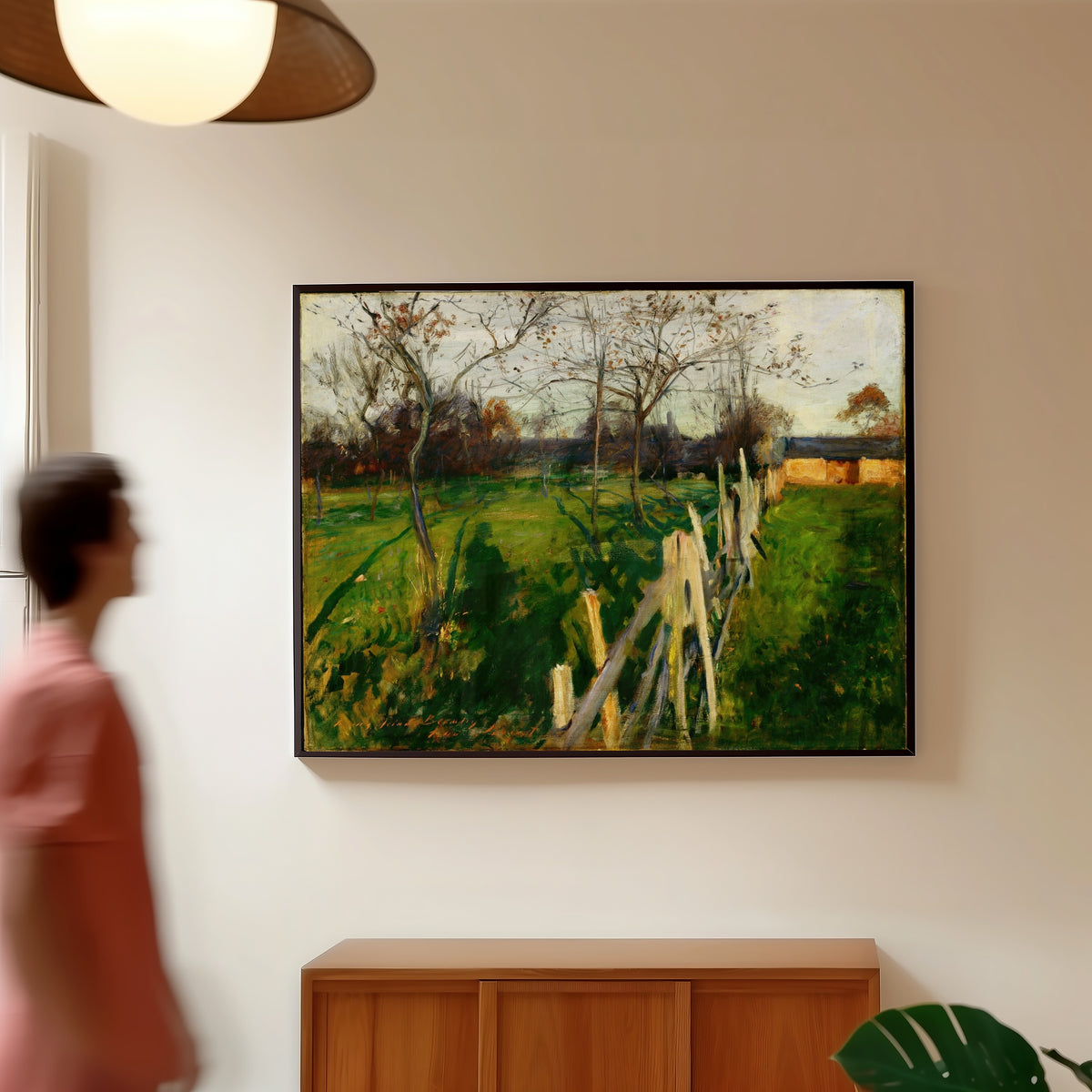 Framed art print of Home Fields by John Singer Sargent, in a slim black frame on a warm wall in a sunlit room