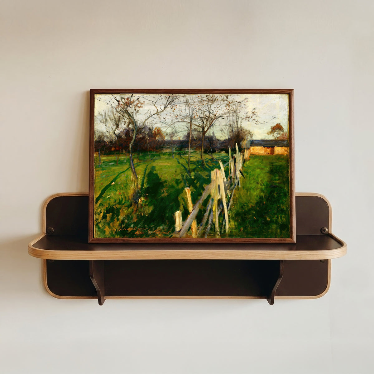 Framed art print of Home Fields by John Singer Sargent, in a dark wood frame resting on a wall shelf
