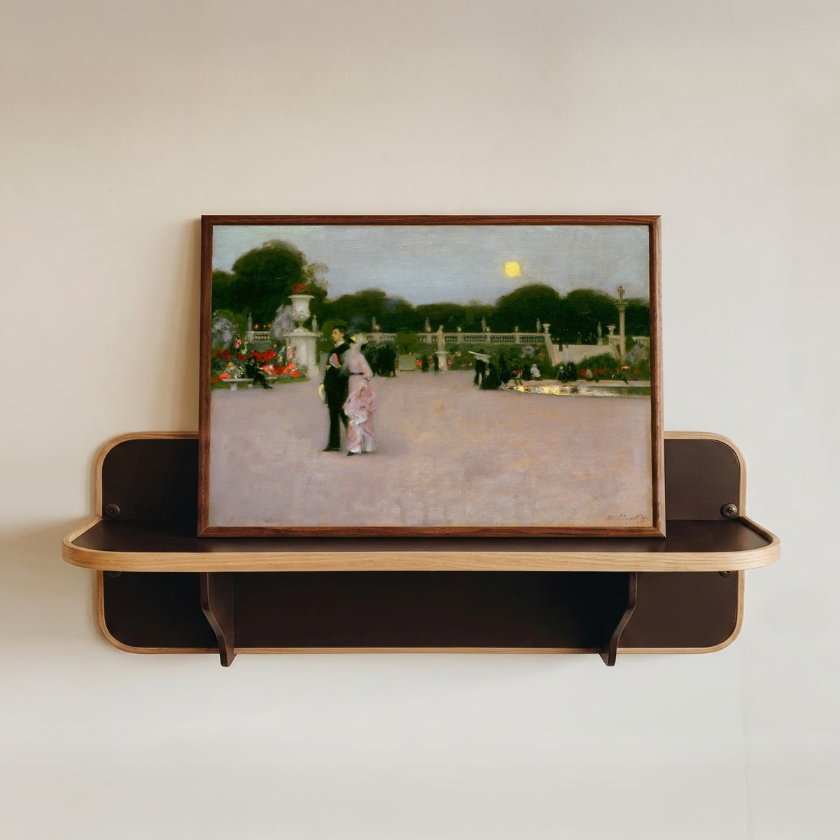 Framed art print of In the Luxembourg Gardens by John Singer Sargent, in a dark wood frame resting on a wall shelf