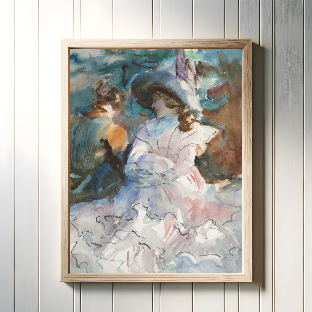 Framed art print of Ladies in the Shade, Abriès by John Singer Sargent, in a light wood frame on a white panelled wall