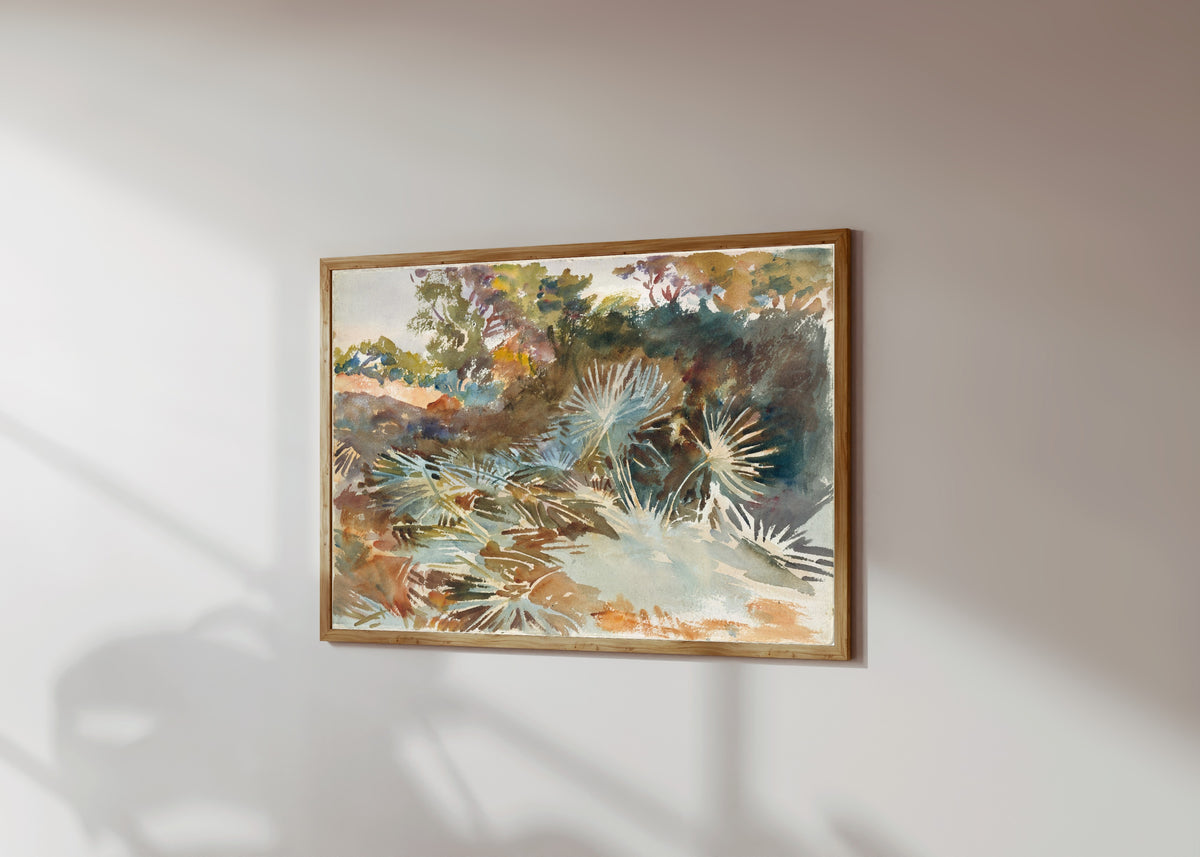 Framed art print of Landscape with Palmettos by John Singer Sargent, in a light wood frame on a sunlit white wall, seen at a slight angle
