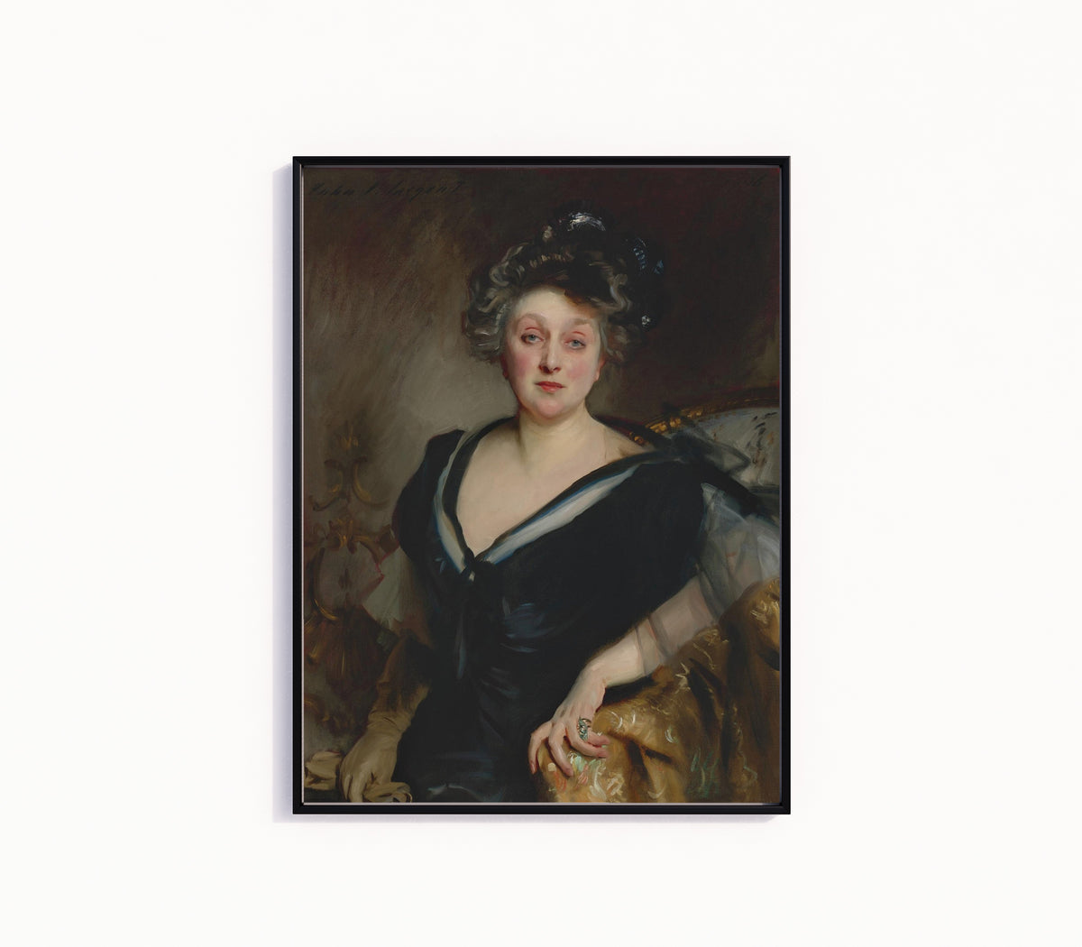 Framed art print of Mrs. George Mosenthal by John Singer Sargent, in a slim black frame on a plain white wall