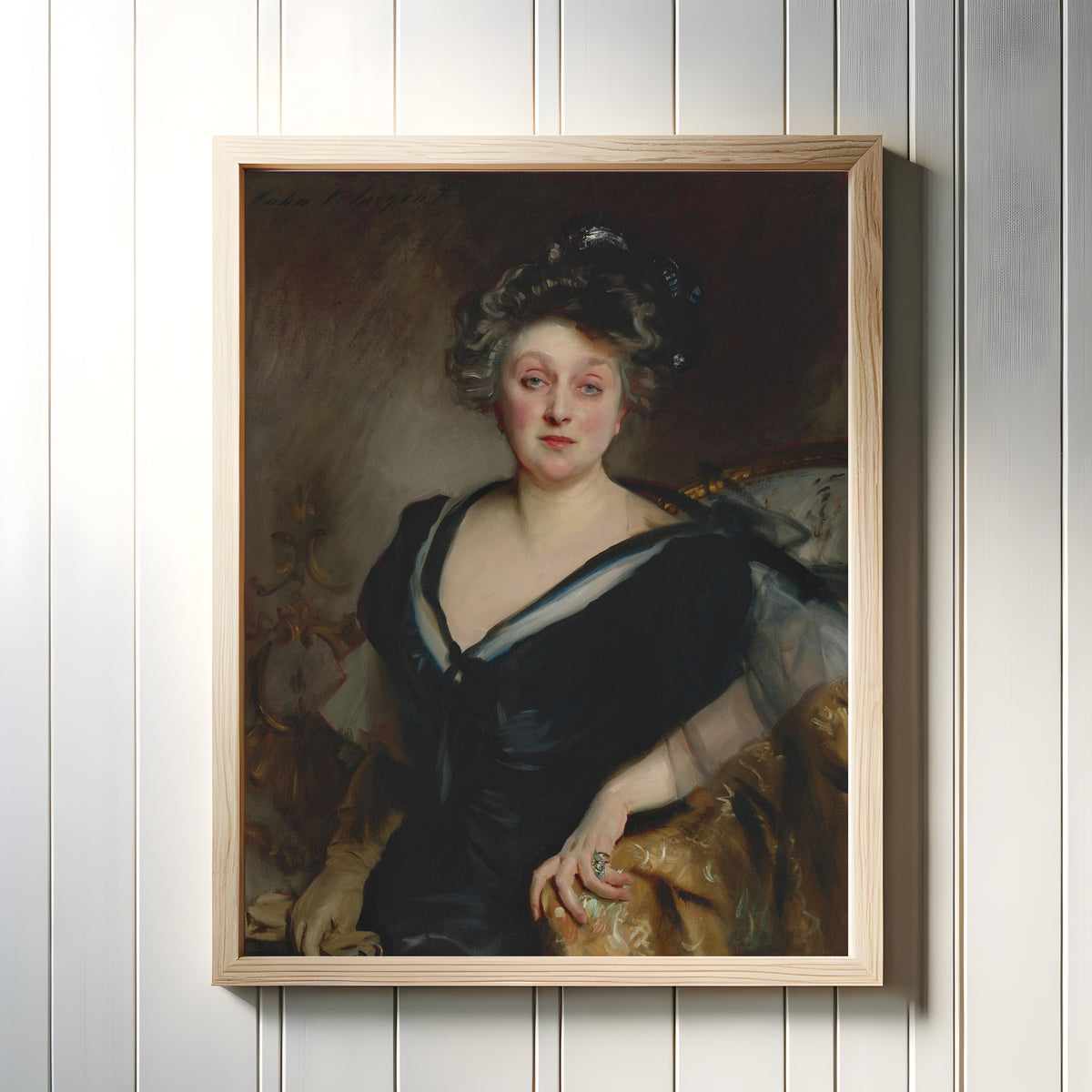 Framed art print of Mrs. George Mosenthal by John Singer Sargent, in a light wood frame on a white panelled wall