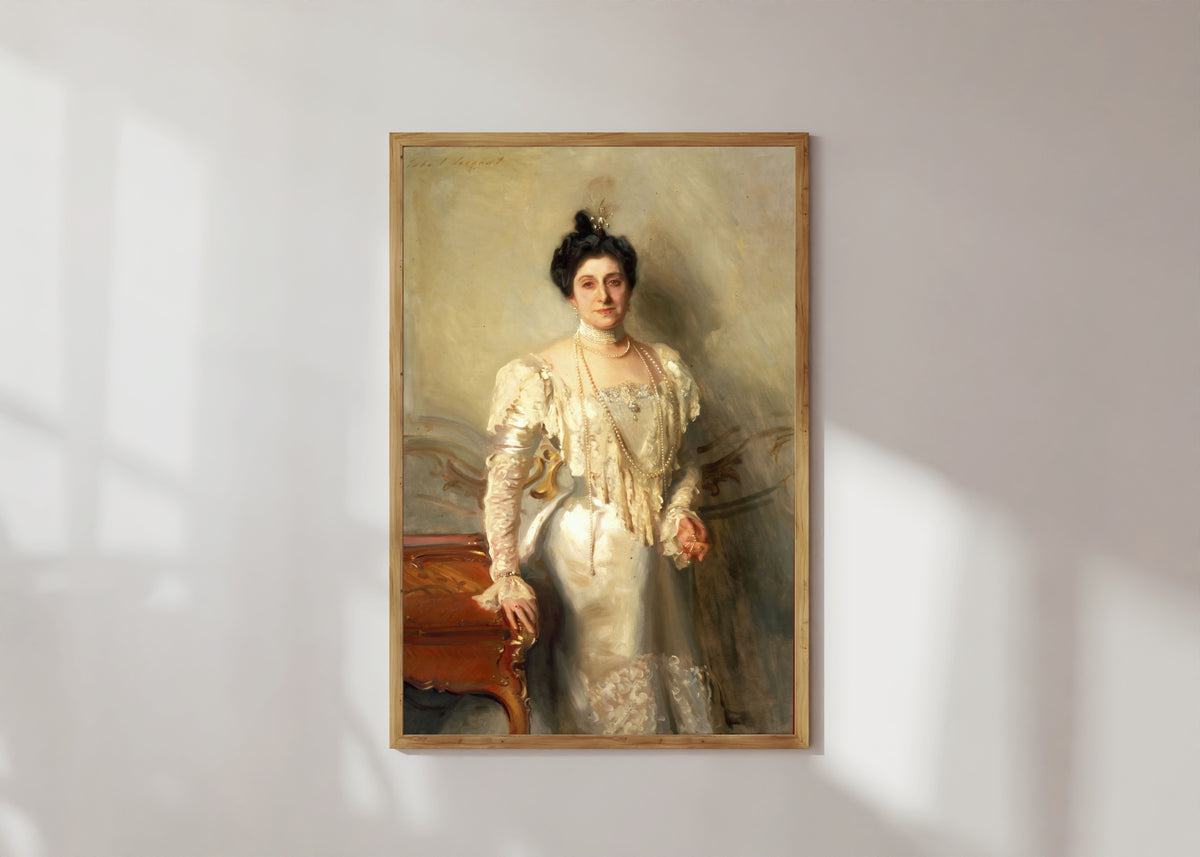 Framed art print of Portrait of Mrs. Asher B. Wertheimer by John Singer Sargent, in a light wood frame on a sunlit white wall