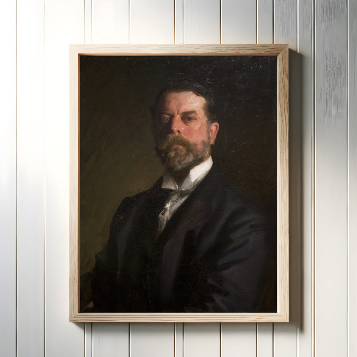Framed art print of Self-Portrait by John Singer Sargent, in a light wood frame on a white panelled wall
