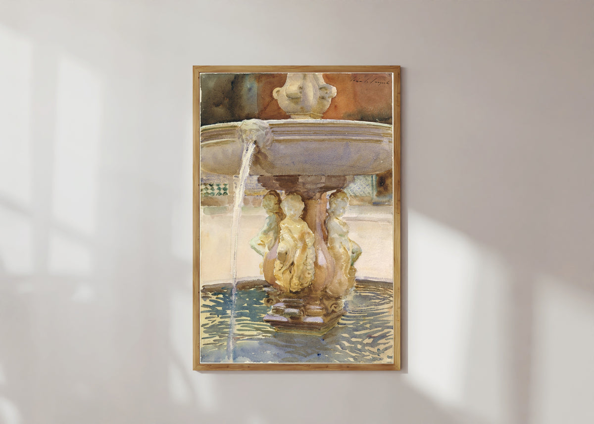 Framed art print of Spanish Fountain by John Singer Sargent, in a light wood frame on a sunlit white wall