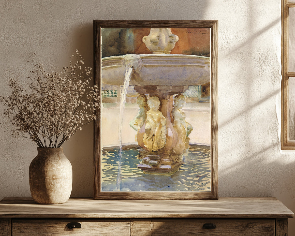 Framed art print of Spanish Fountain by John Singer Sargent, in a dark wood frame leaning on a rustic console beside dried flowers