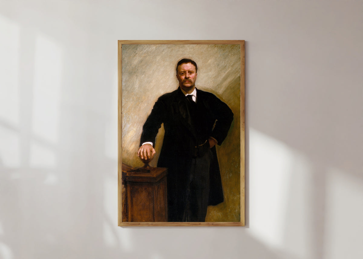 Framed art print of Theodore Roosevelt by John Singer Sargent, in a light wood frame on a sunlit white wall