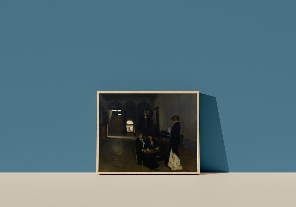 Framed art print of Venetian Bead Stringers by John Singer Sargent, in a light wood frame leaning on a blue wall
