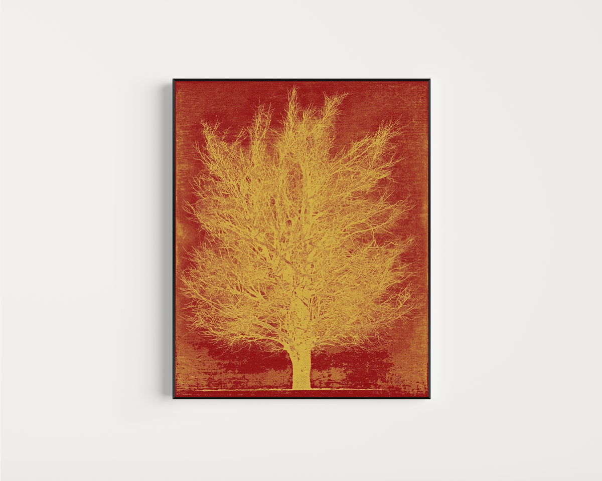 Framed art print of Gold Tree by Joichi Hoshi, in a slim black frame on a plain white wall