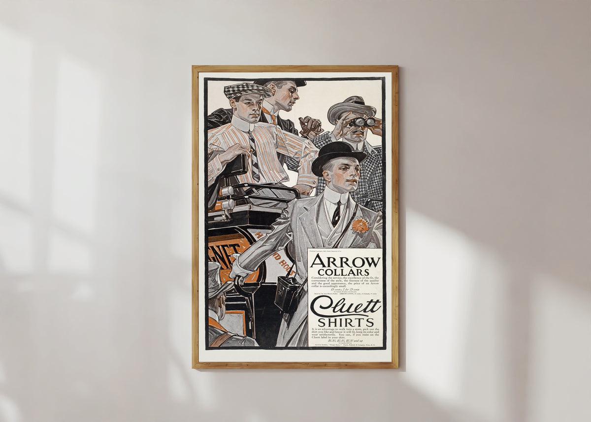 Framed art print of Arrow Collars & Cluett Shirts by J.C. Leyendecker, in a light wood frame on a sunlit white wall