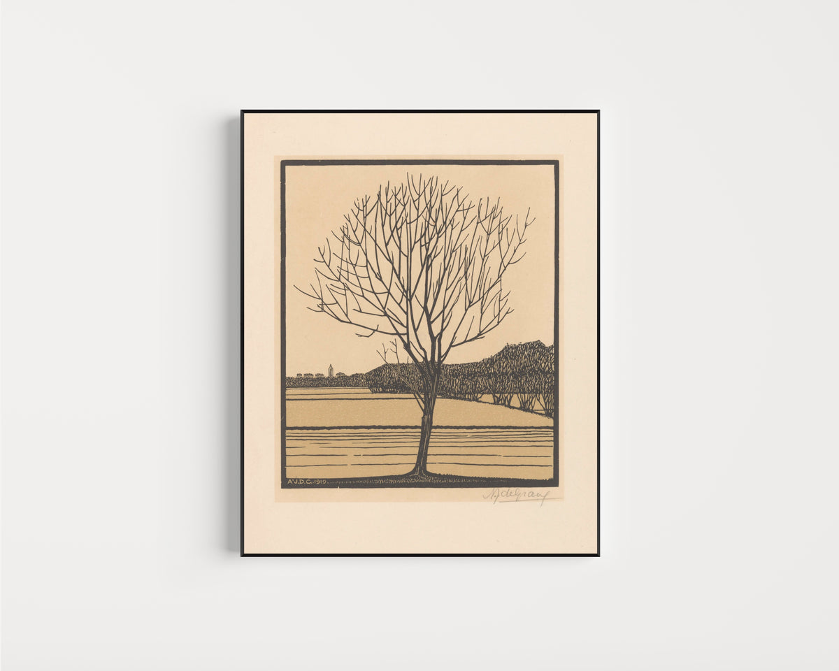 Framed art print of Bare Tree by Water by Julie de Graag, in a slim black frame on a plain white wall