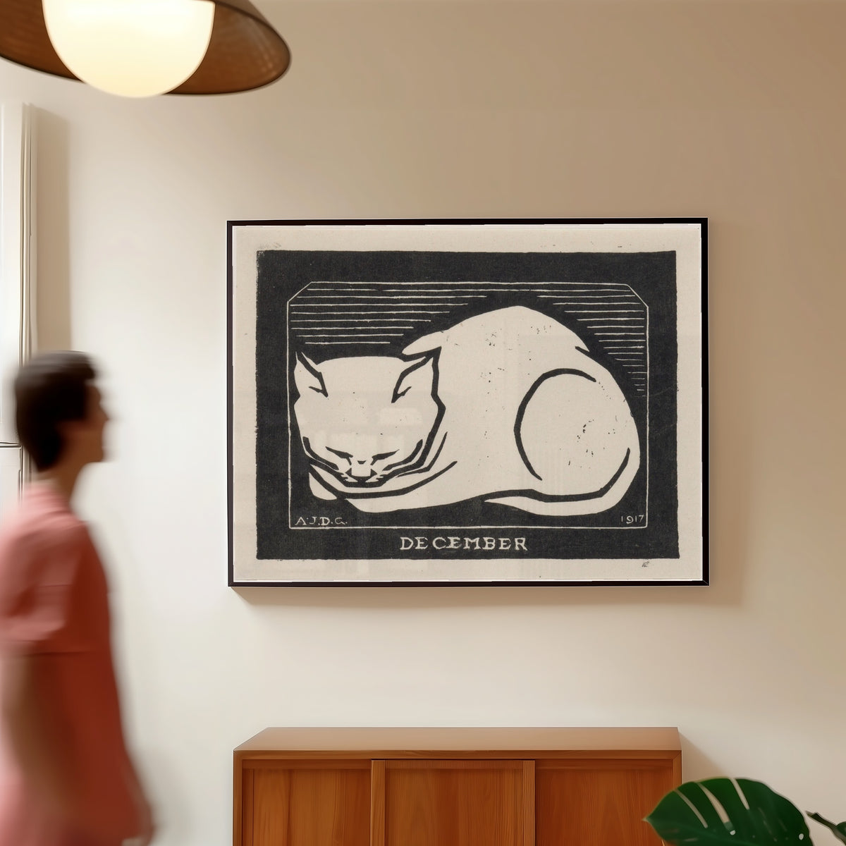 Framed art print of December by Julie de Graag, in a slim black frame on a warm wall in a sunlit room