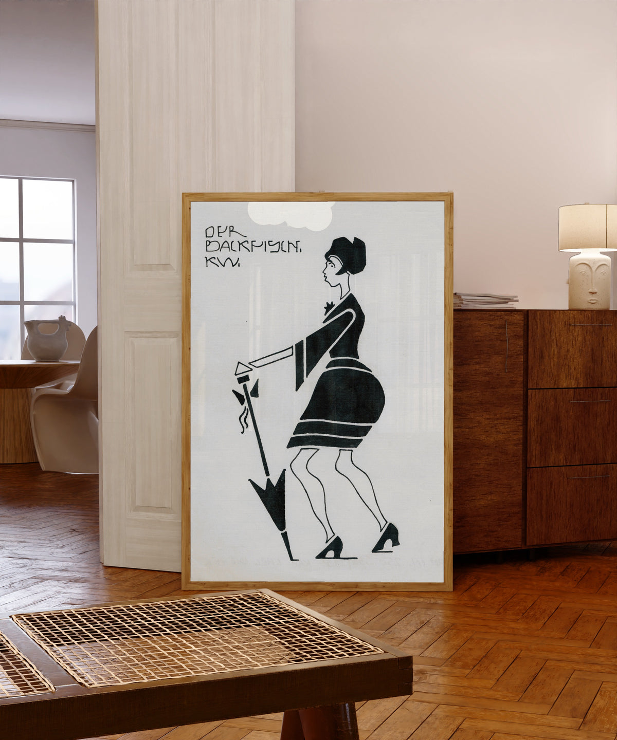 Framed art print of Der Backfisch (The Teenage Girl) by Karl Wiener, in a light wood frame leaning in a warm room with a parquet floor