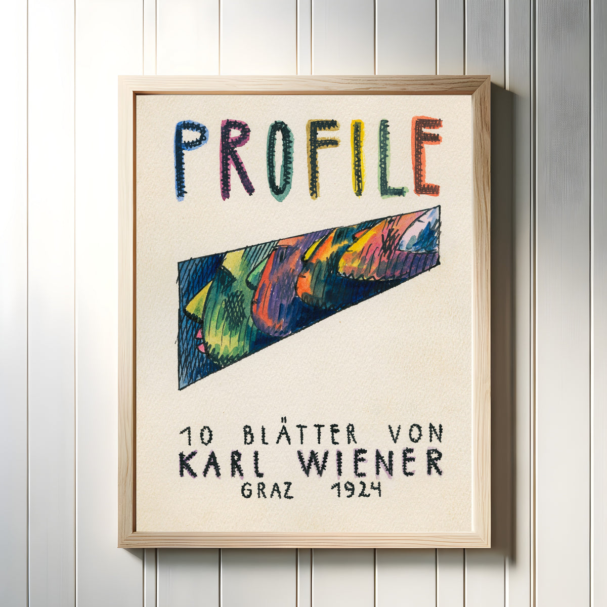 Framed art print of Profile, 10 Blätter (Profiles, Title Sheet) by Karl Wiener, in a light wood frame on a white panelled wall