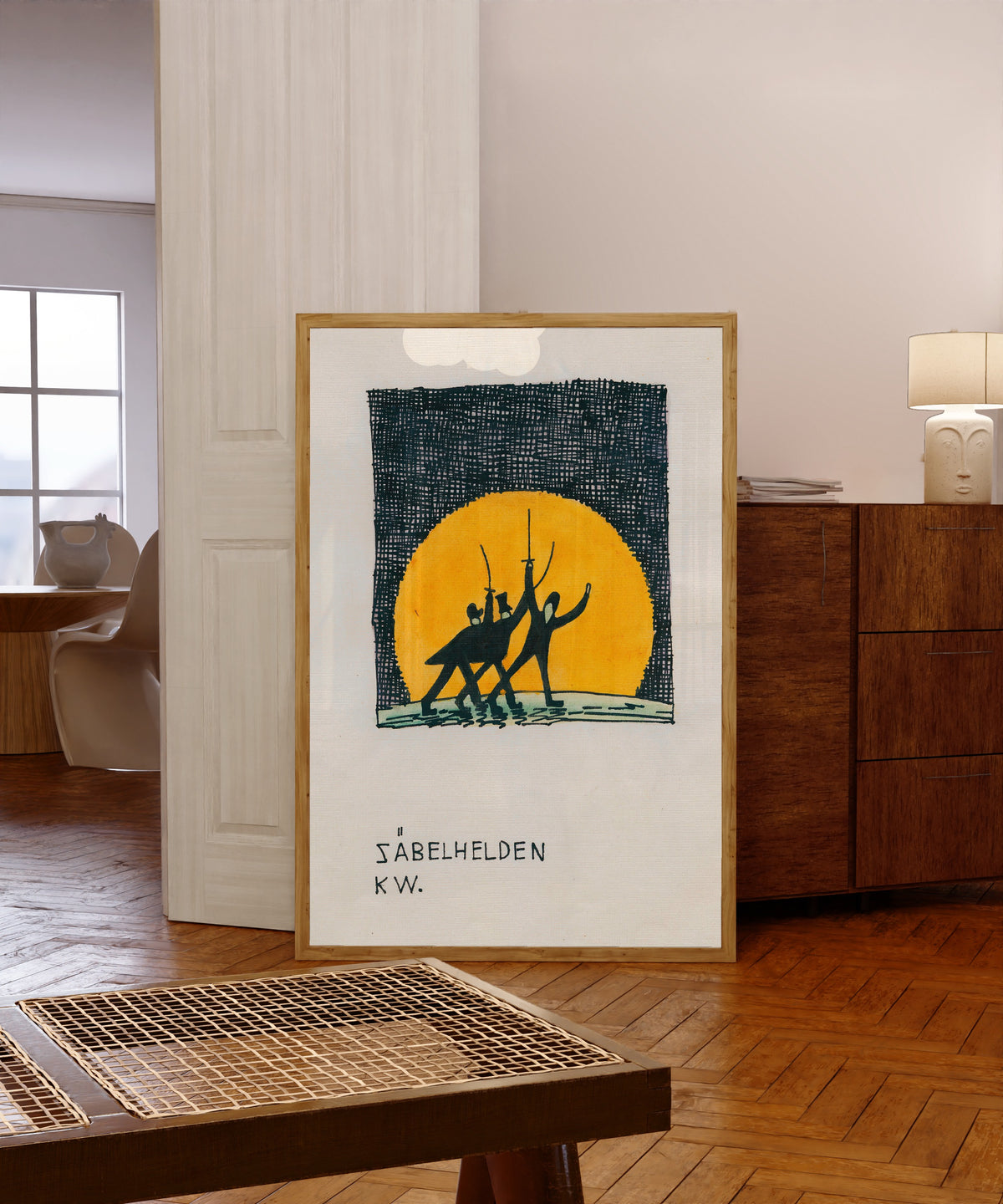 Framed art print of Säbelhelden (Sabre Heroes) by Karl Wiener, in a light wood frame leaning in a warm room with a parquet floor