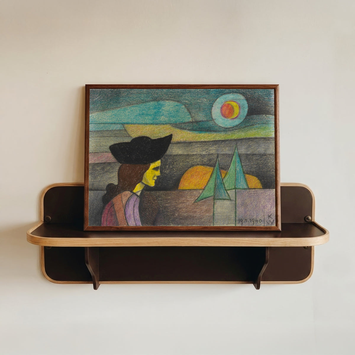 Framed art print of Untitled (Woman with a Black Hat) by Karl Wiener, in a dark wood frame resting on a wall shelf