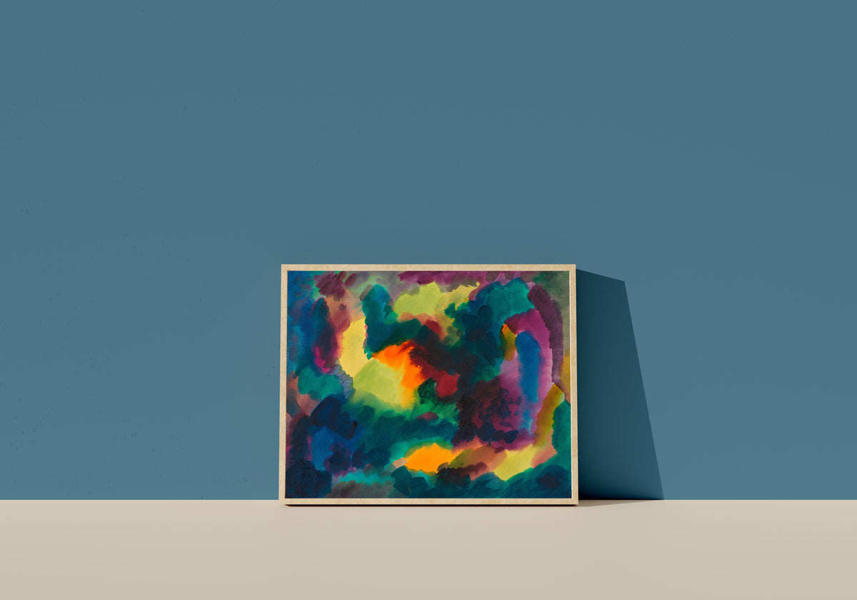 Framed art print of Zersetzung I (Decomposition I) by Karl Wiener, in a light wood frame leaning on a blue wall