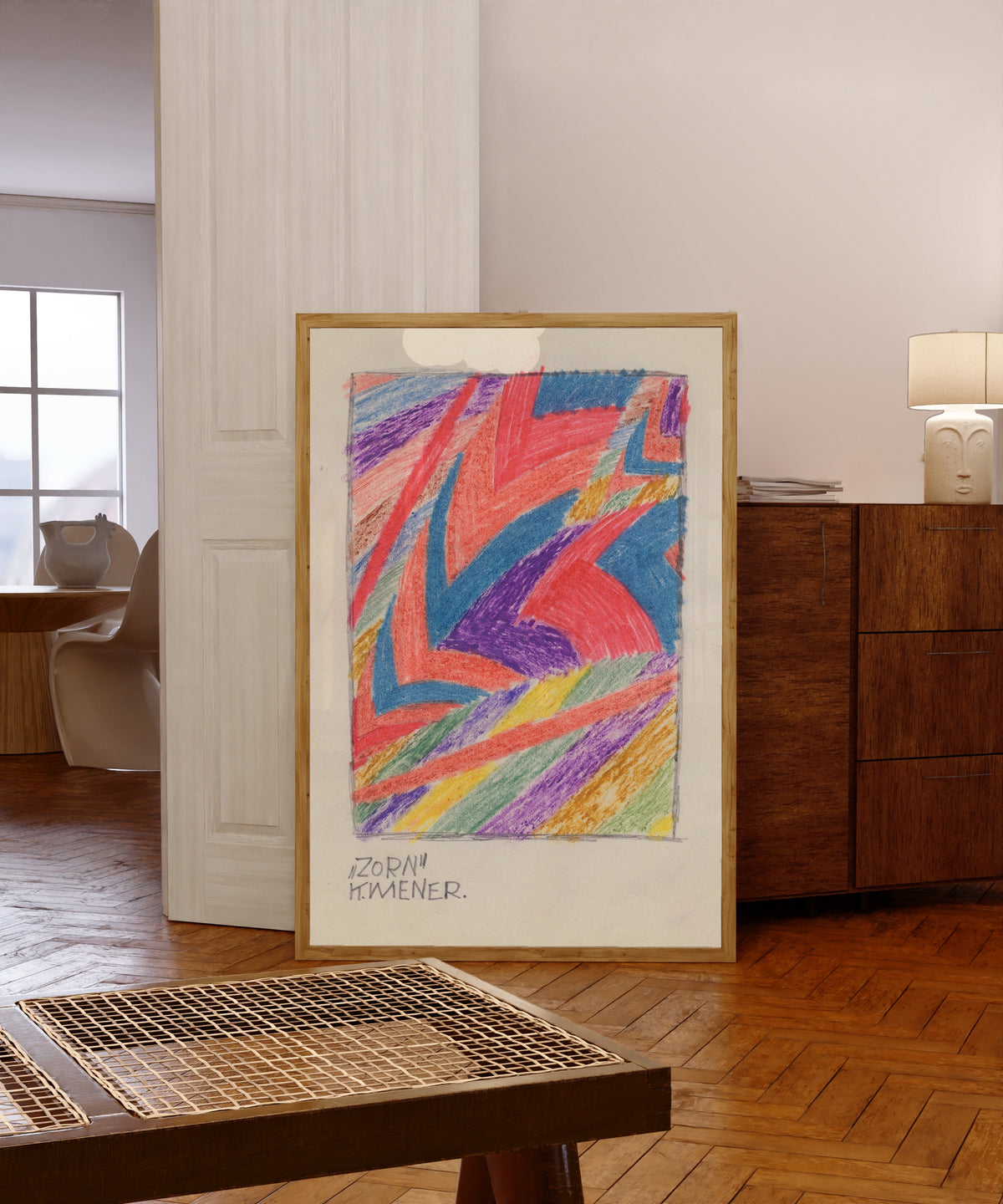 Framed art print of Zorn (Anger) by Karl Wiener, in a light wood frame leaning in a warm room with a parquet floor