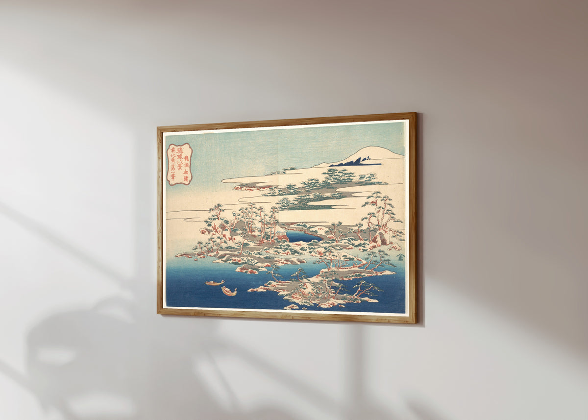 Framed art print of Eight Views of the Ryūkyū Islands: Pines and… by Katsushika Hokusai, in a light wood frame on a sunlit white wall, seen at a slight angle
