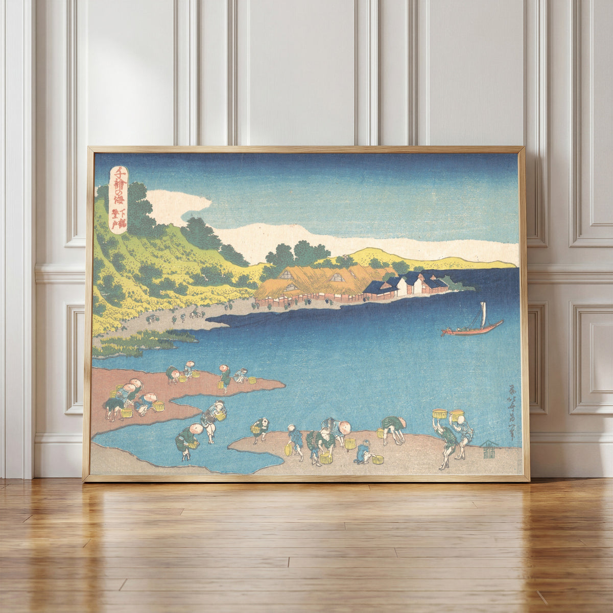 Framed art print of One Thousand Pictures of the Sea: Noboto at Shimōsa by Katsushika Hokusai, in a light wood frame leaning against a panelled white wall
