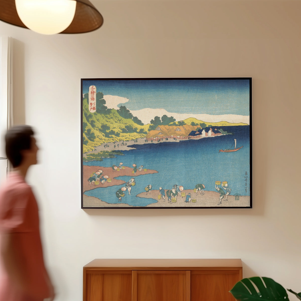 Framed art print of One Thousand Pictures of the Sea: Noboto at Shimōsa by Katsushika Hokusai, in a slim black frame on a warm wall in a sunlit room